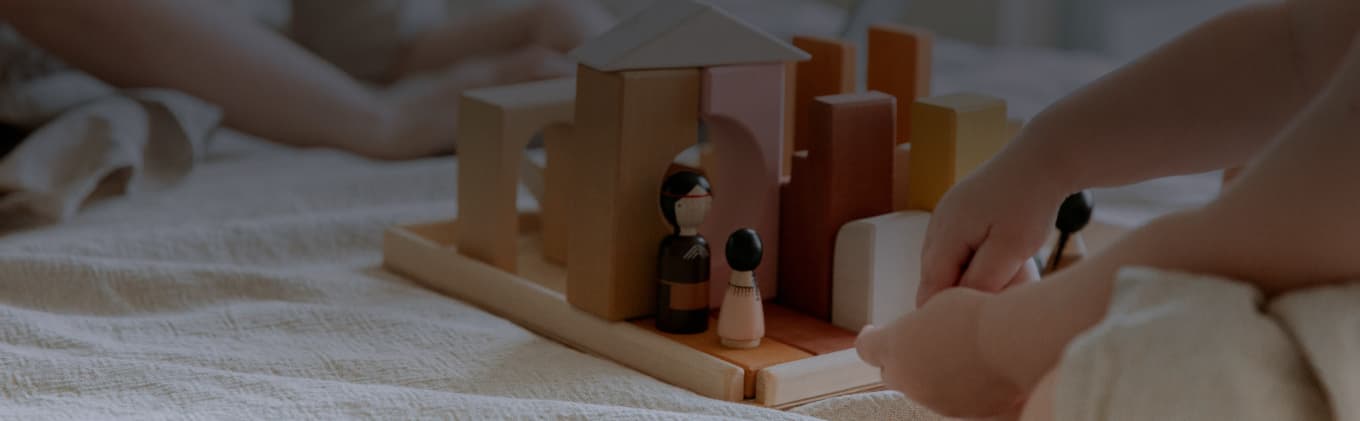 Wooden toyset on bed